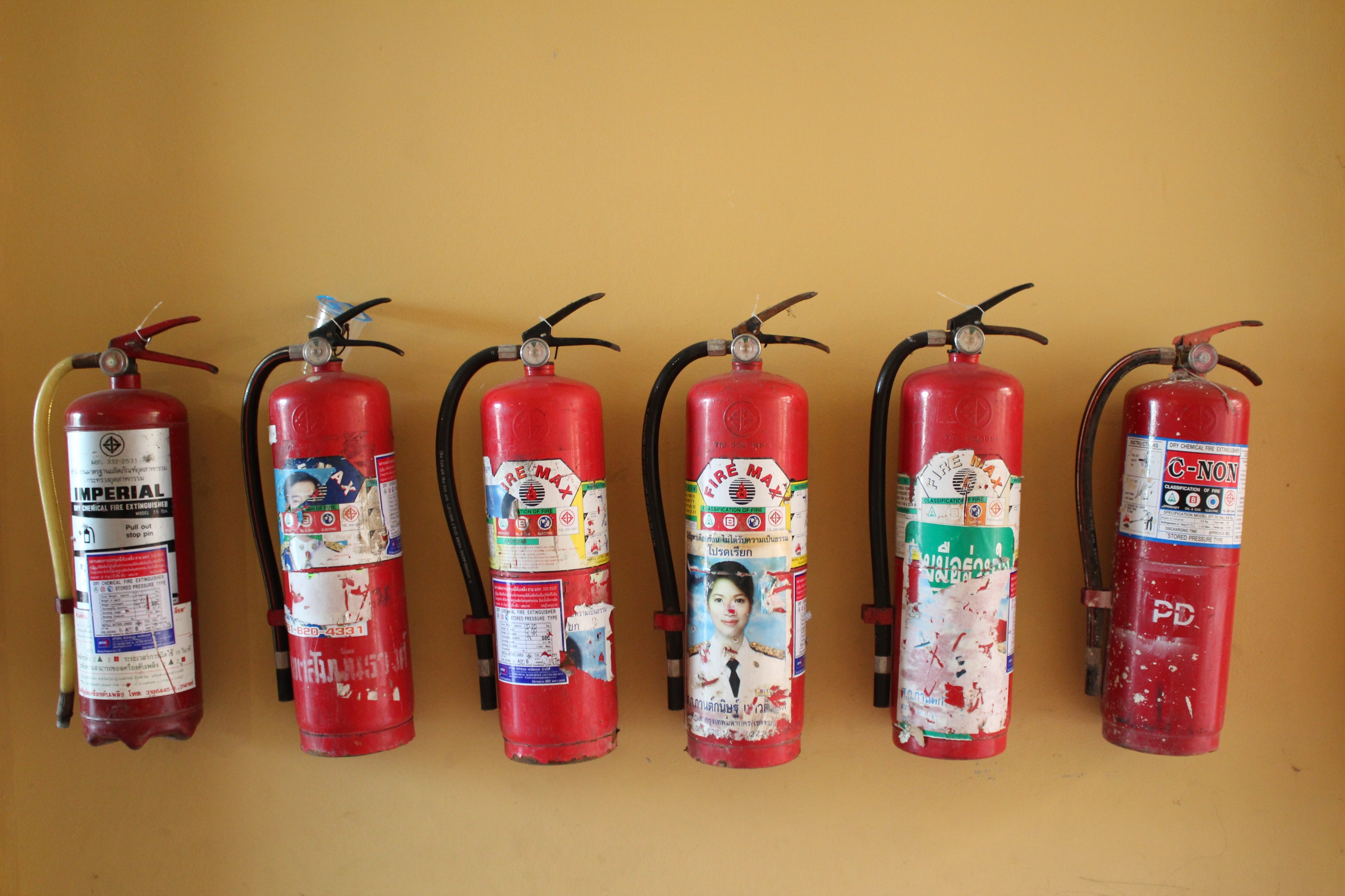6 red fire extinguishers
