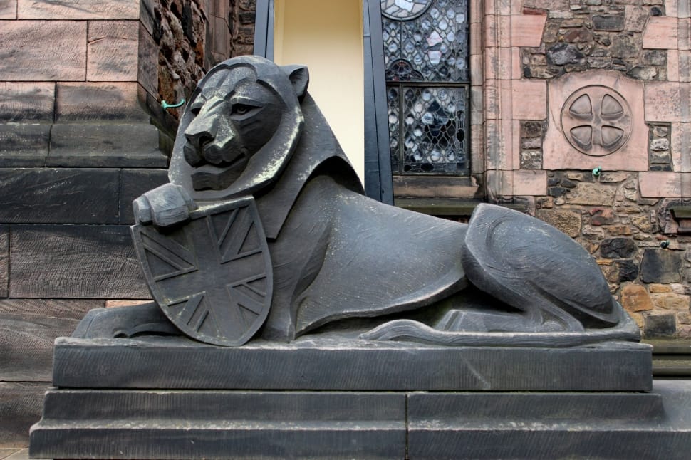 black concrete statue of a lion preview