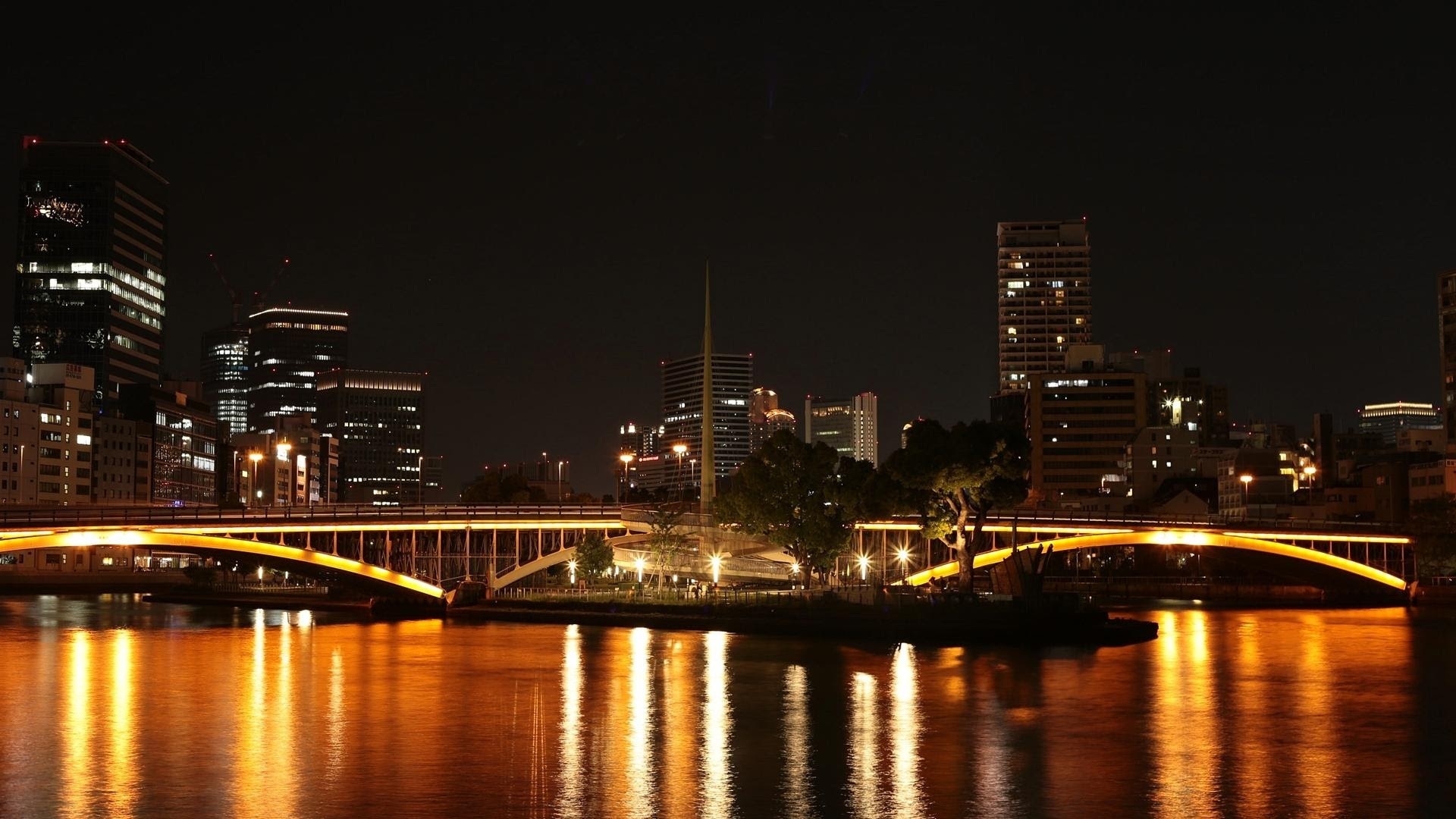 gray lighted city bridge
