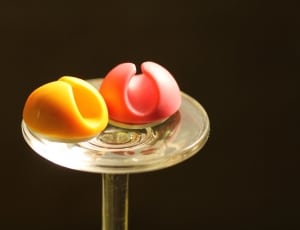 two gummy candies on a clear glass wine glass stem thumbnail