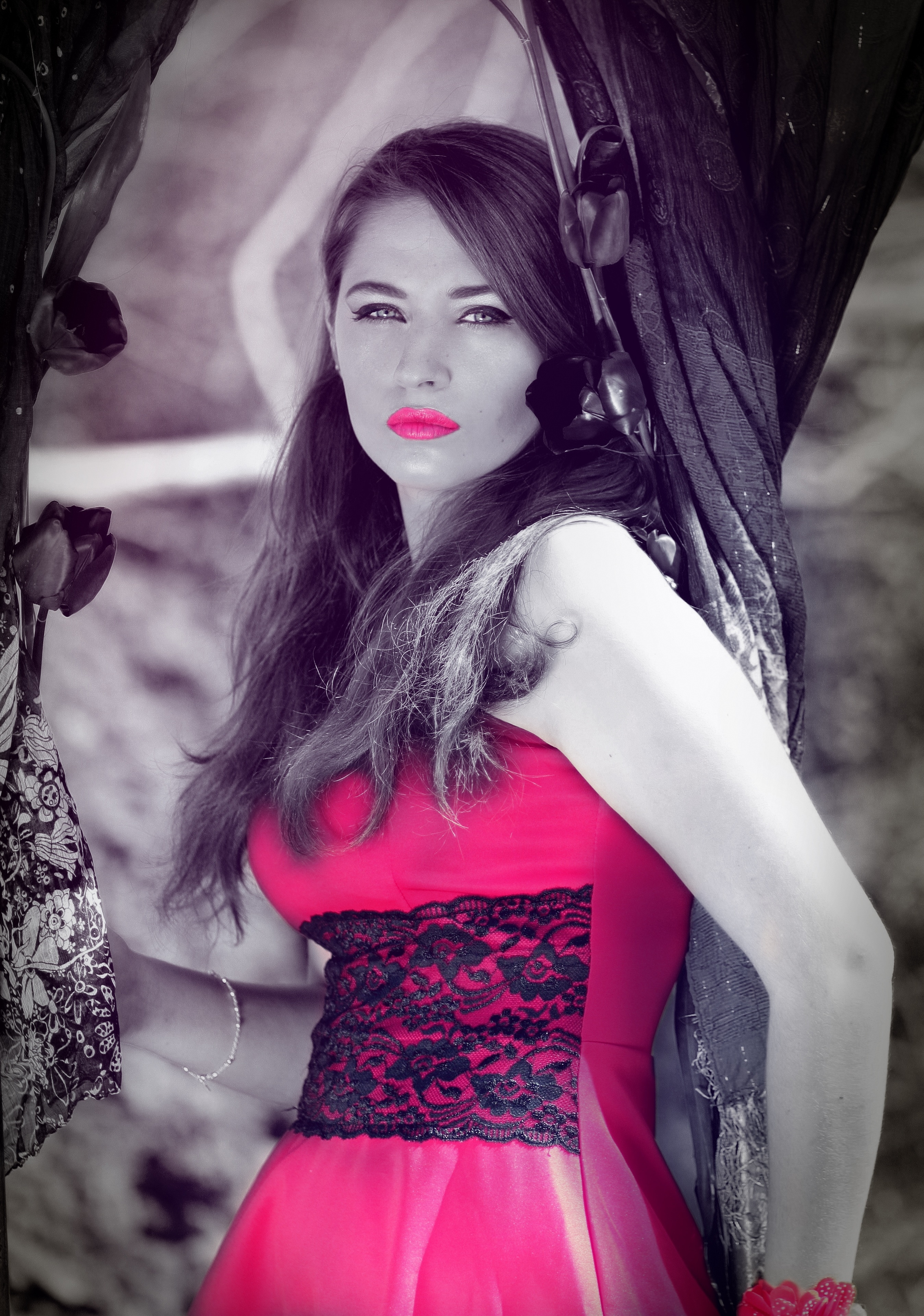 selective color photo of women's red and black dress