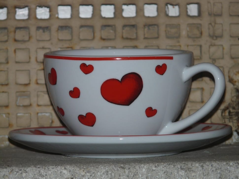 white and  red ceramic heart carved teacup and saucer preview