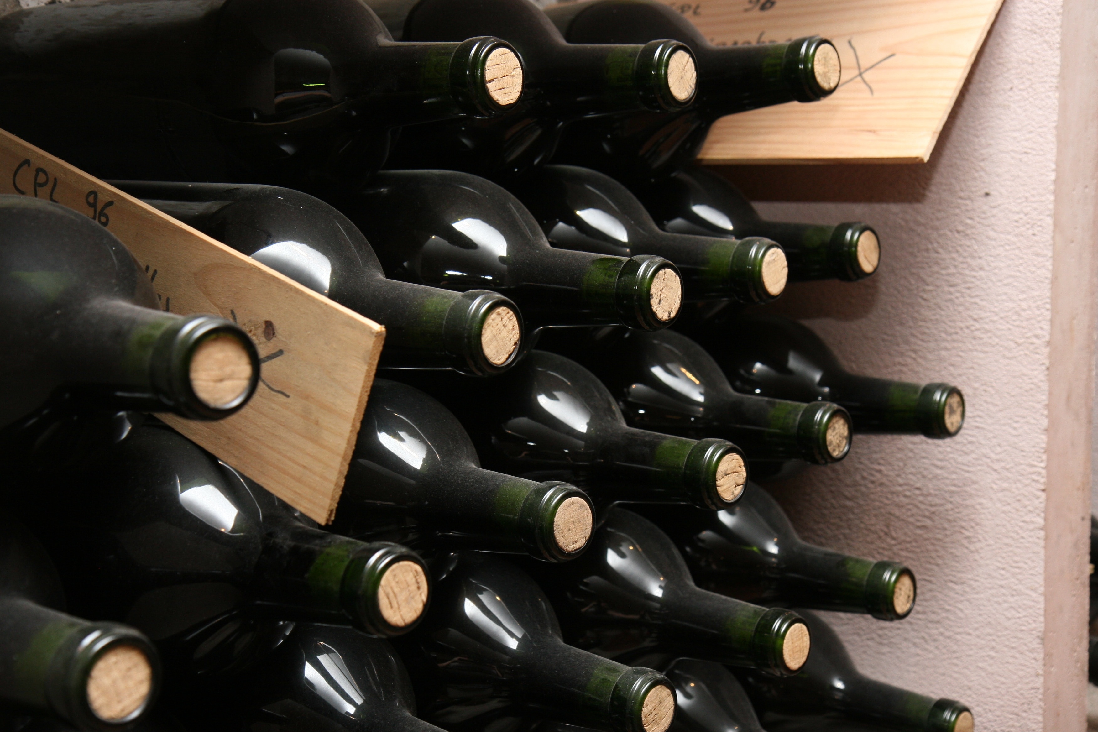 wine bottle lot in brown wooden box