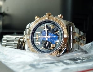 gold and silver 2 toned blue chronograph watch thumbnail