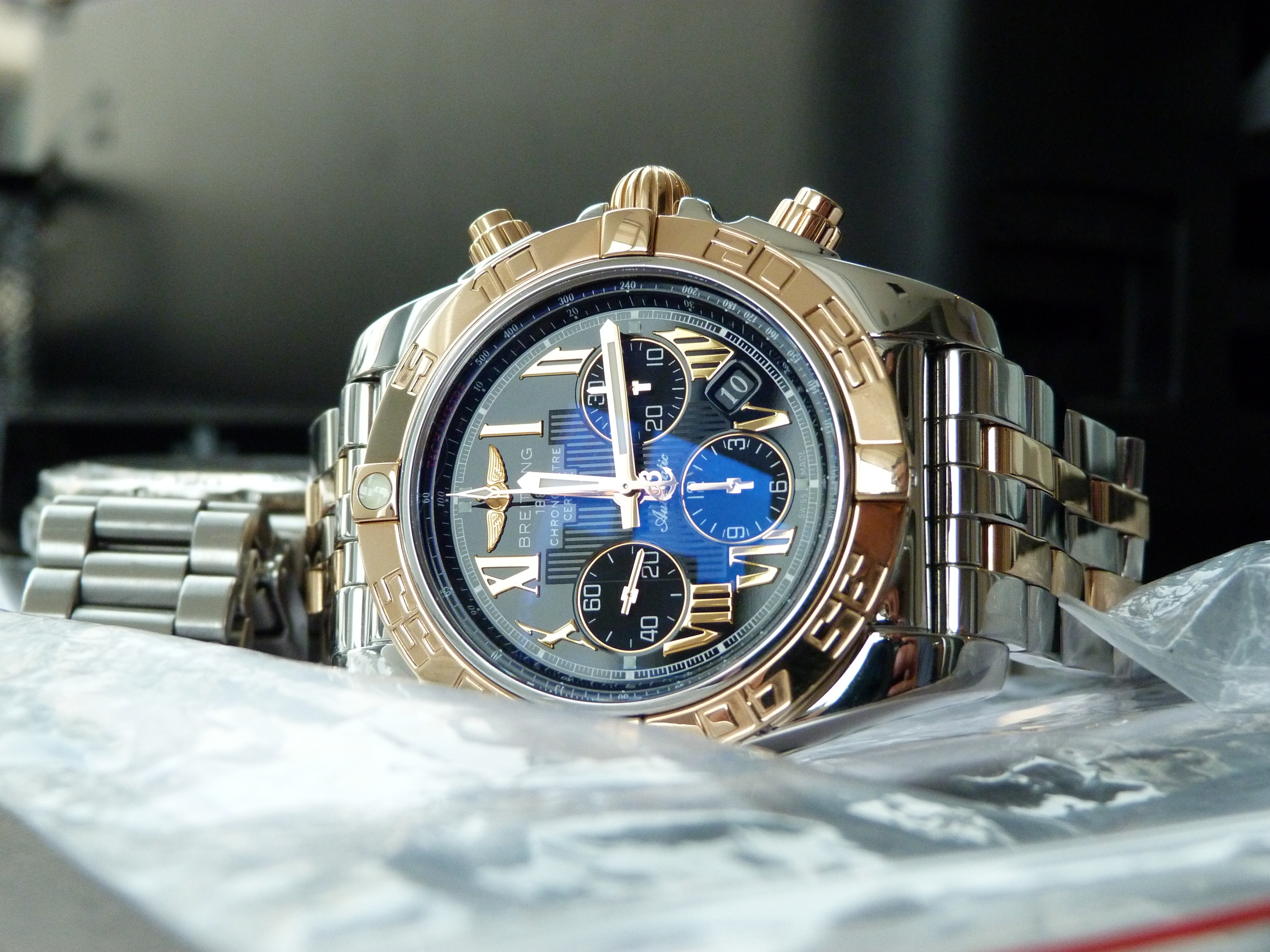 gold and silver 2 toned blue chronograph watch