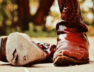 pair of brown leather cowboy boots thumbnail