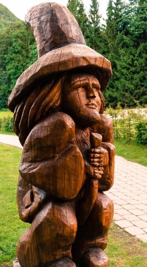 brown wooden man sculpture thumbnail