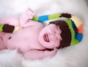 baby's brown green blue yellow and orange knit hat aviators thumbnail