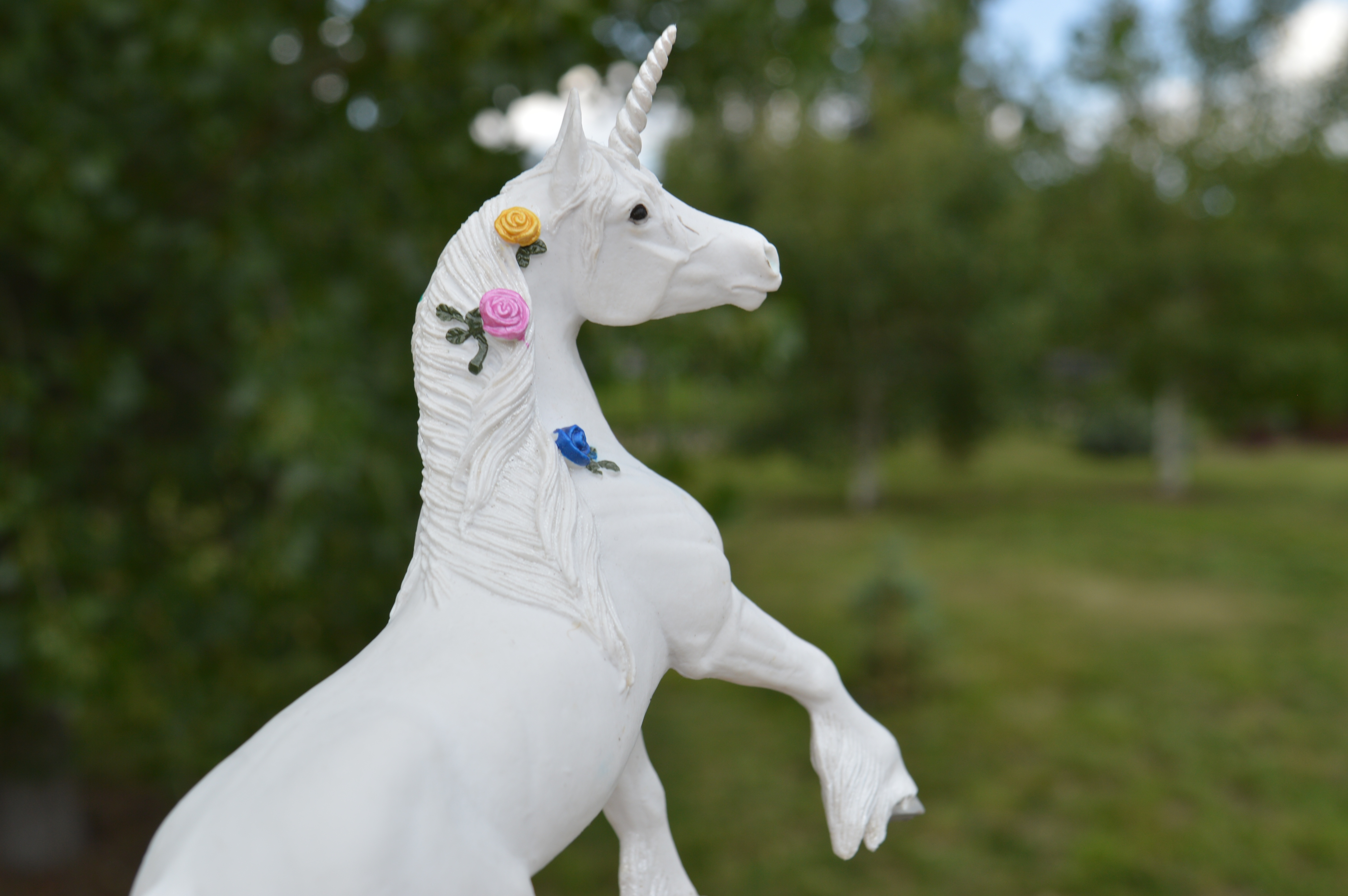 white ceramic unicorn horse