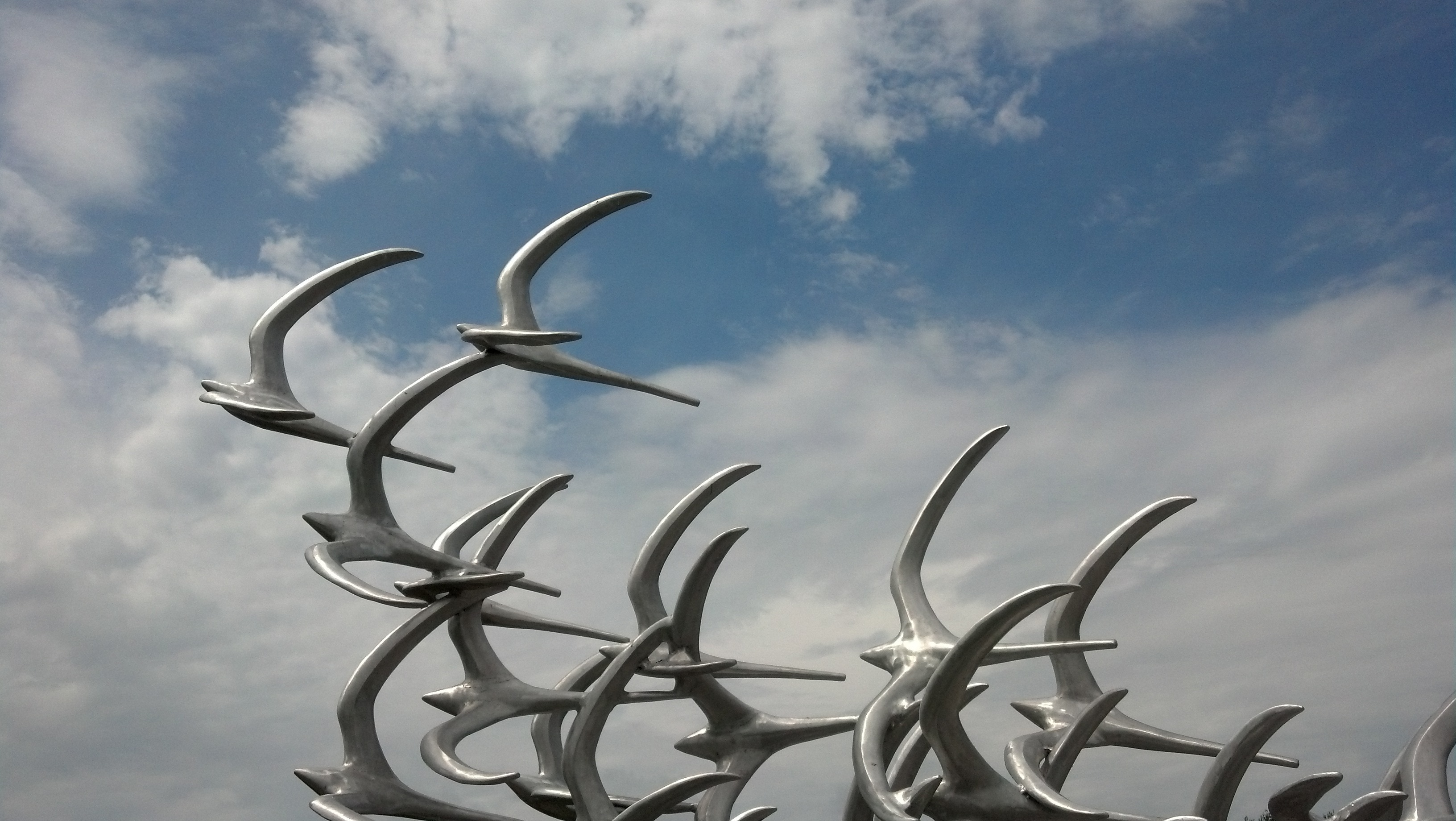 flock of white birds statue