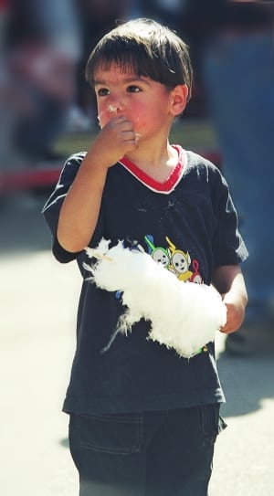 boy eating white cotton candy thumbnail