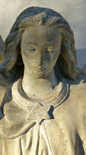 woman angel with eye pin on dress figurine thumbnail