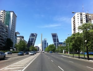 high rise buildings and grey cars thumbnail
