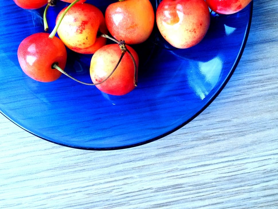 red fruits with blue glass plate preview