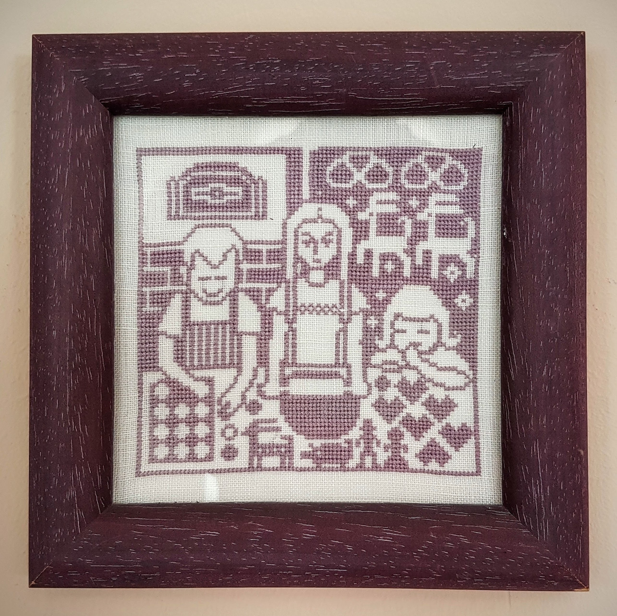 brown wooden framed knit textile and 3 person