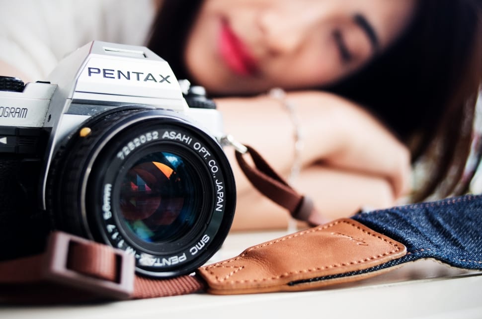 selective focus photography of gray and black pentax dslr camera preview