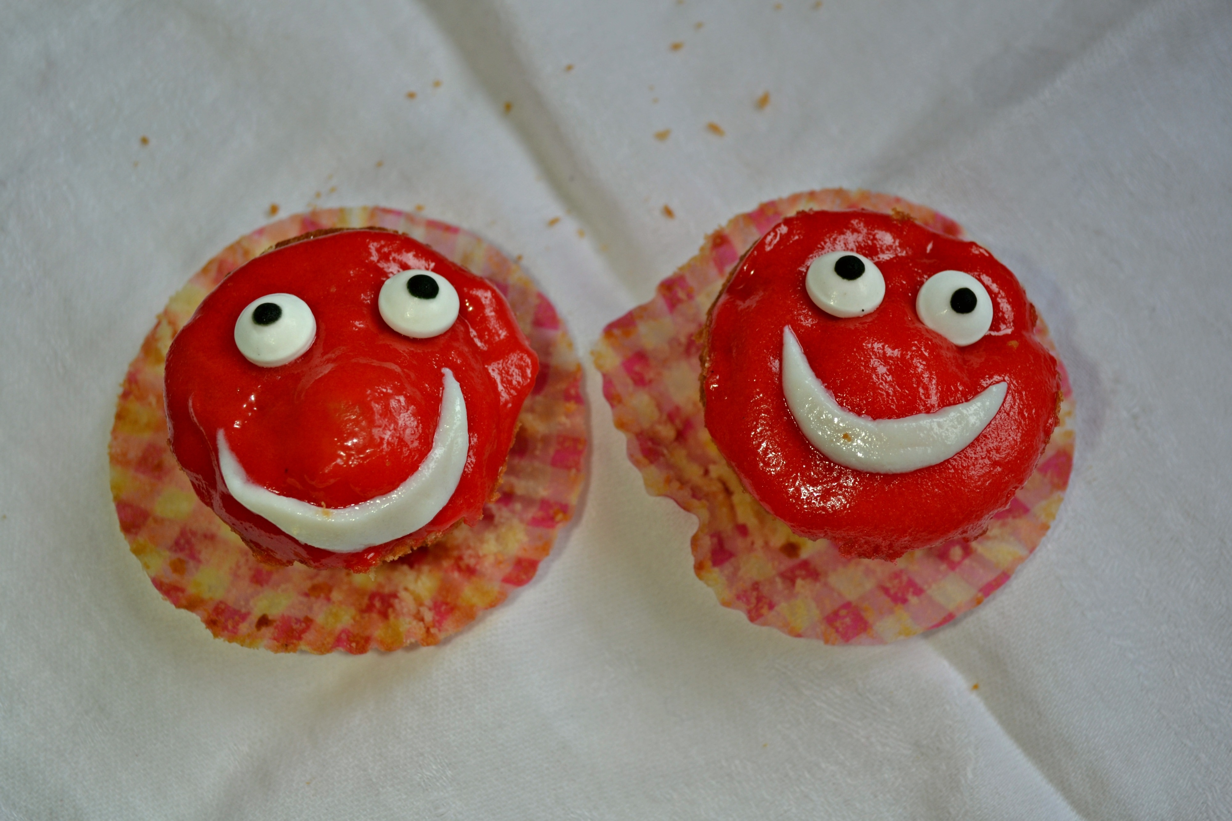 2 red-and-white cupcakes