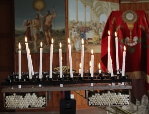white candles on black candle holders thumbnail