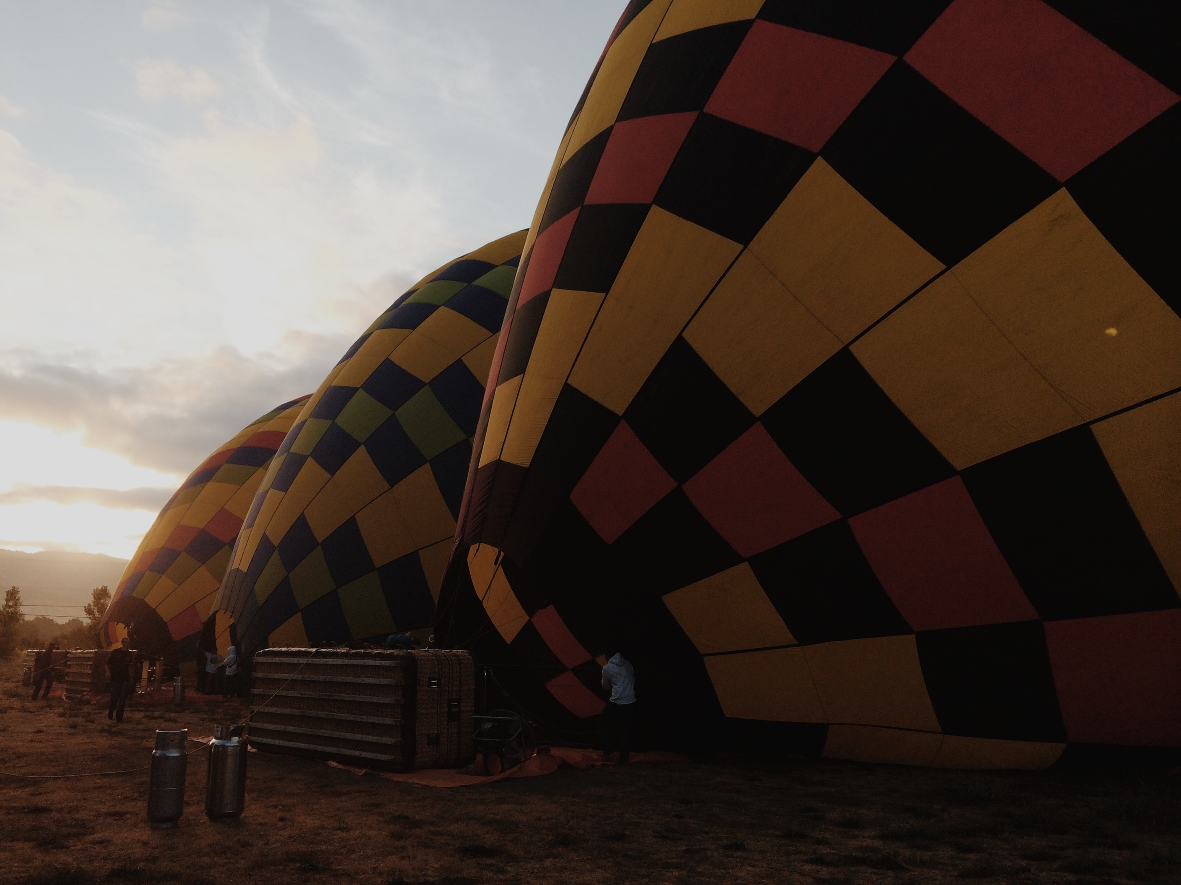3 yellow black and red hot air balloons