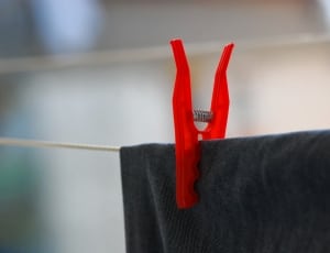 red plastic' clothes peg thumbnail