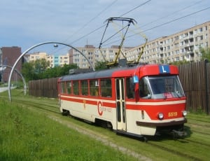 red and beige moving train thumbnail