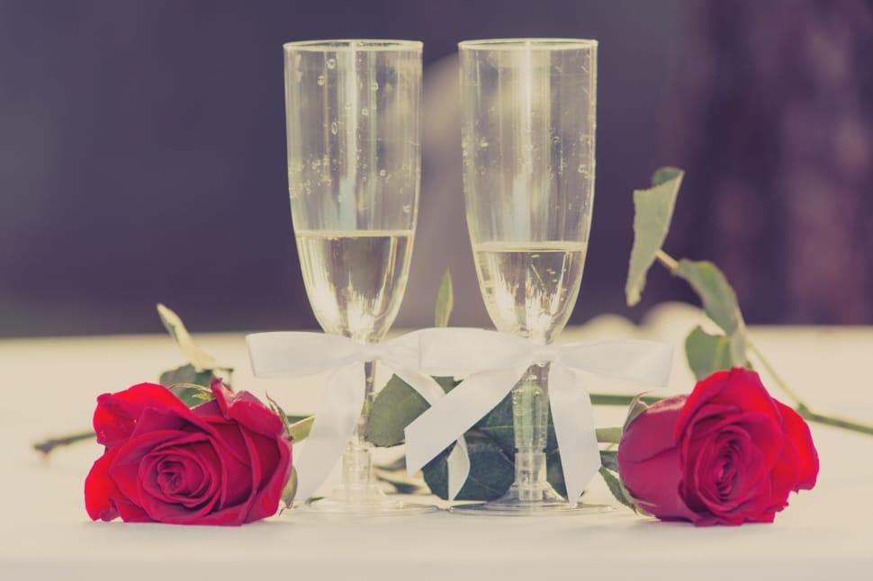 2 clear champagne glass and red roses flower preview