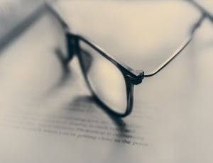 black frame eyeglasses on book thumbnail