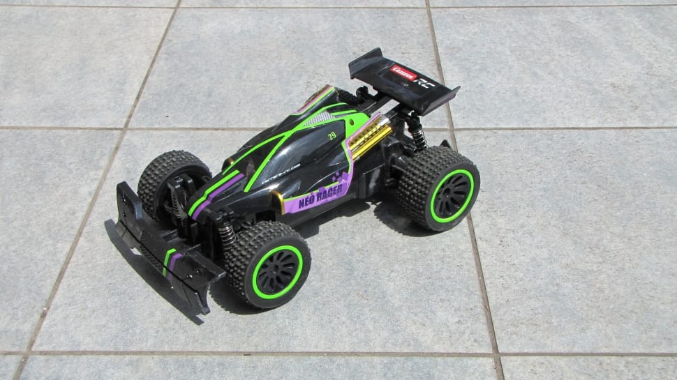 black and green toy race car preview
