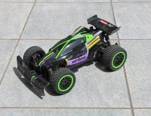 black and green toy race car thumbnail