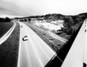 selective focus time lapse photo of car on the road thumbnail