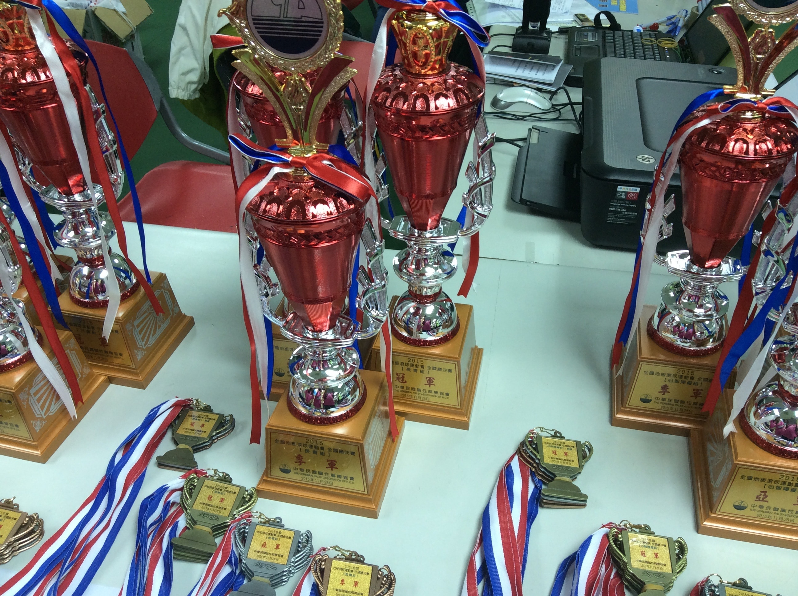 six red trophies