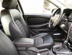 black leather car seat thumbnail