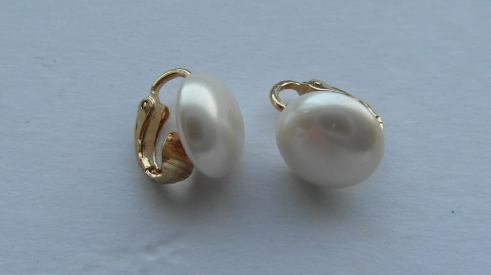 pair of white and gold pearl earrings preview