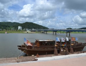 brown boat near dock thumbnail