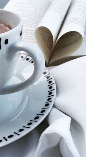 white and black ceramic teacup thumbnail