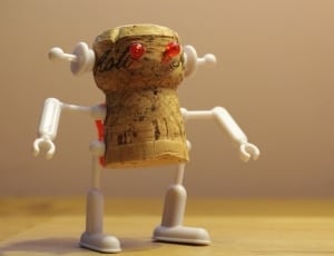 brown and white robot plastic figure thumbnail