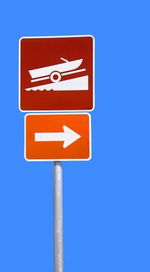 red orange and gray vehicle and arrow road sign thumbnail