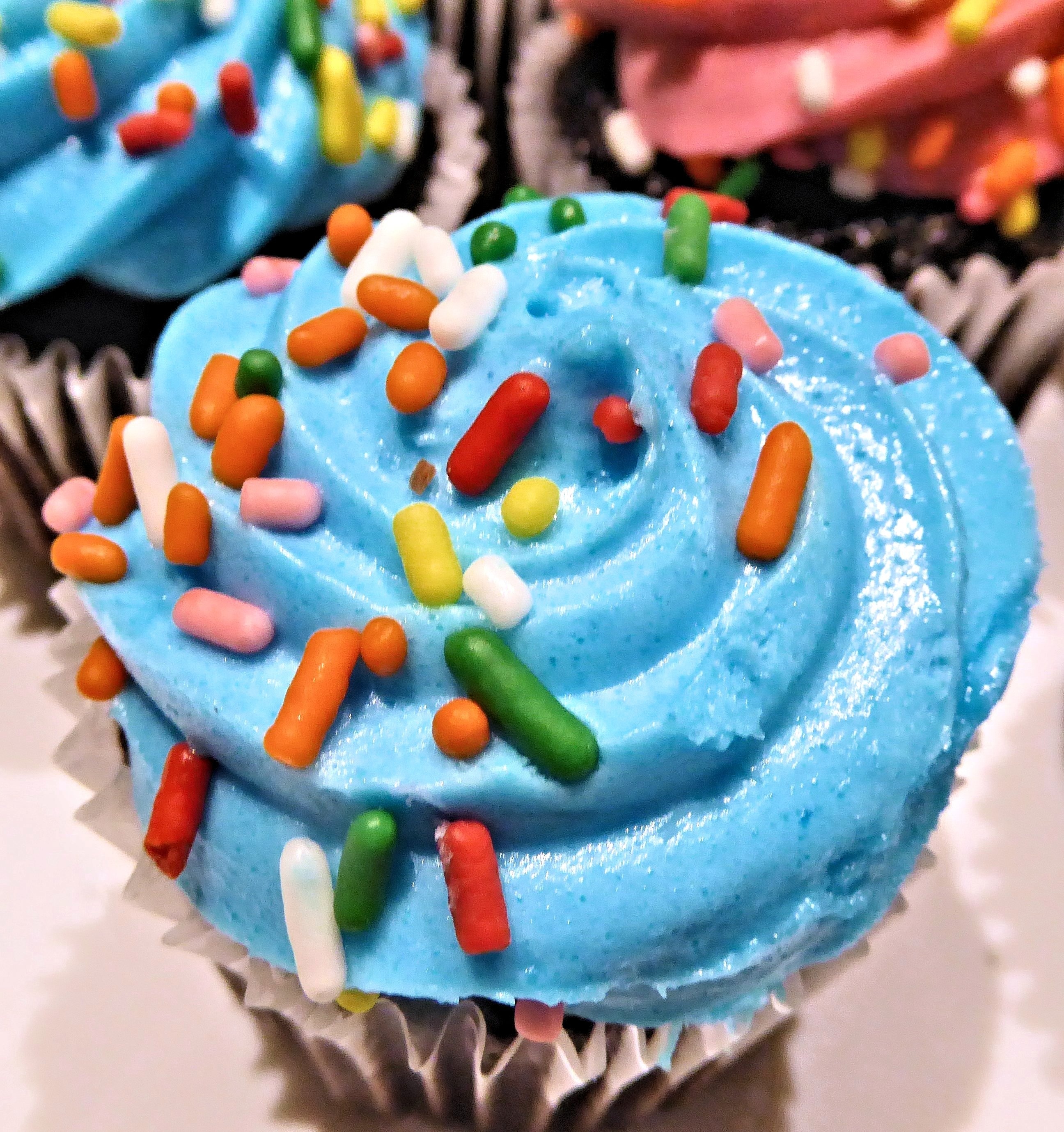 blue multicolored sprinkled cupcakes