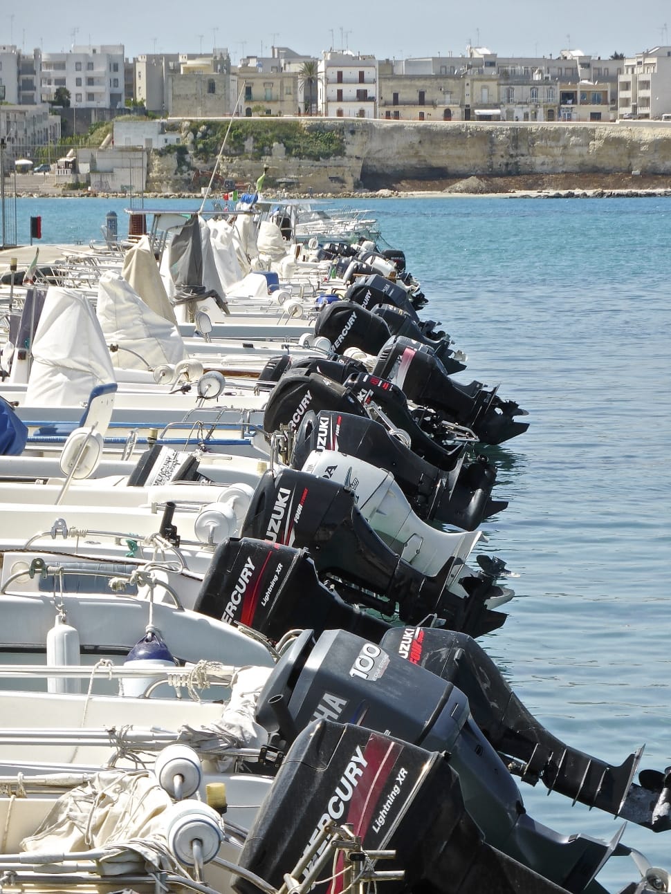 black outboard motors on boat near body of waters during daytime preview