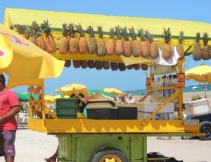 yellow and green pineapple fruit stand stall thumbnail