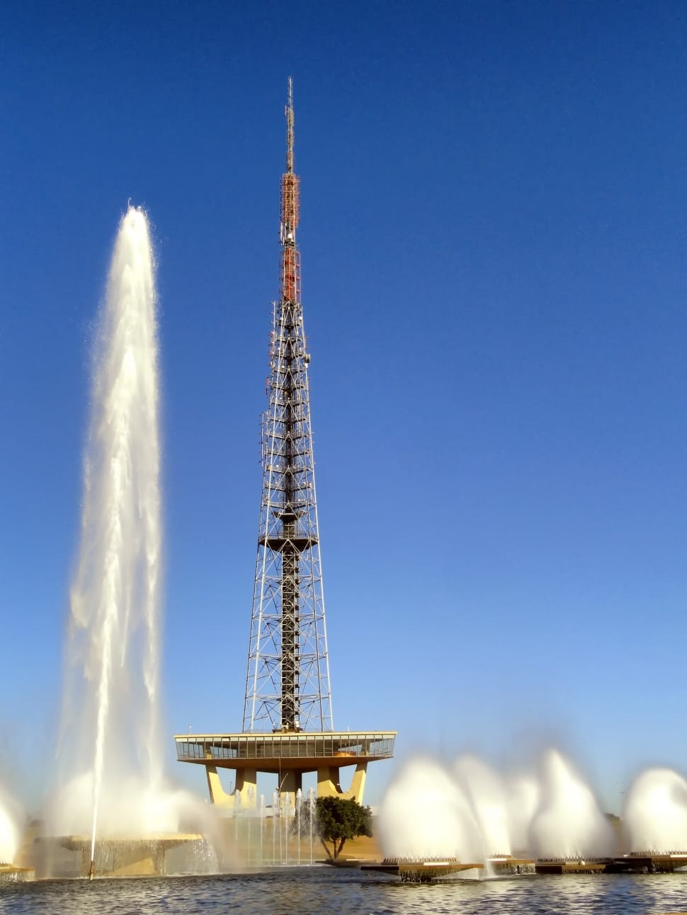 gray brown and gray tv tower surrounded by fountain preview