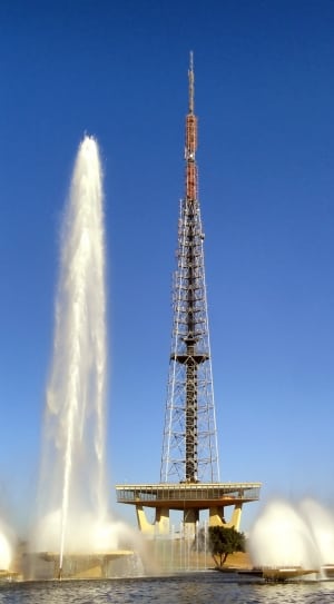 gray brown and gray tv tower surrounded by fountain thumbnail