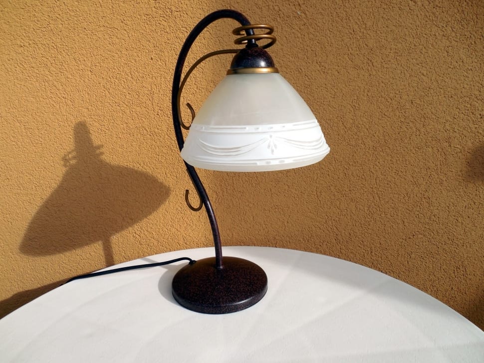 black an white table lamp on white round table preview
