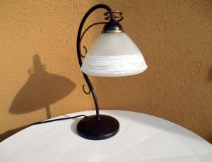 black an white table lamp on white round table thumbnail