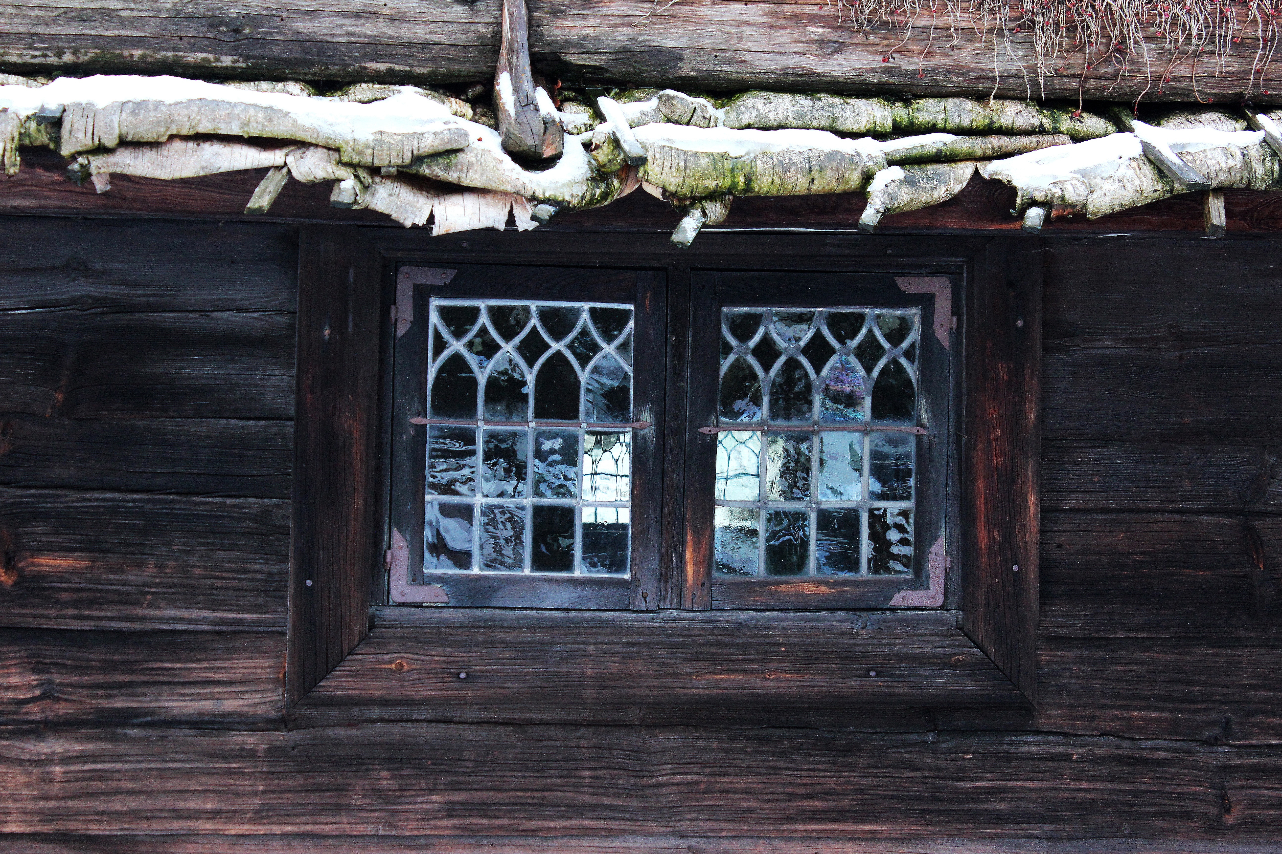 brown wooden frame glassed windowpane