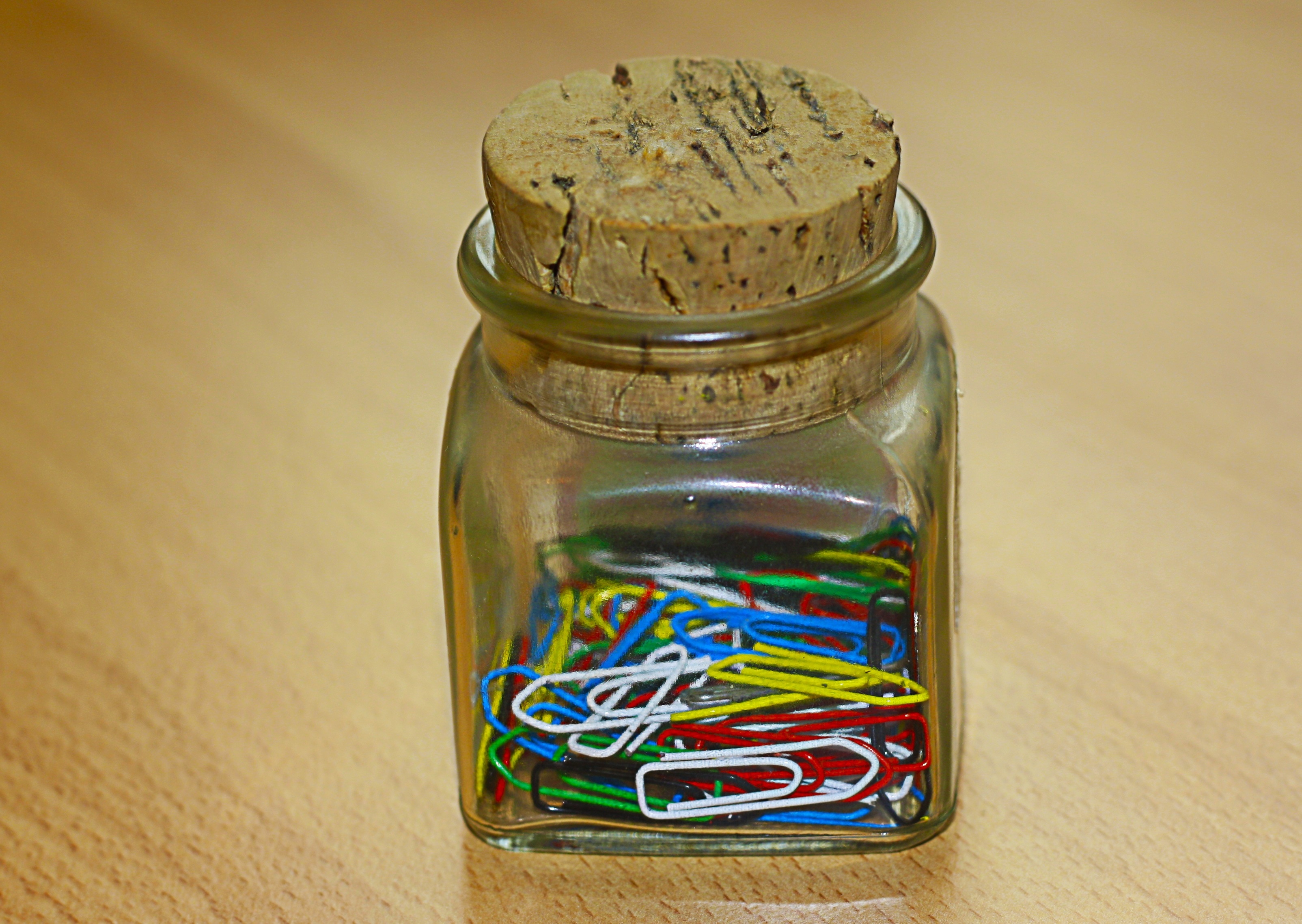 paper clip lot on glass container