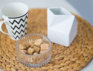 ceramic mug beside brown sugar cubes on the tray thumbnail