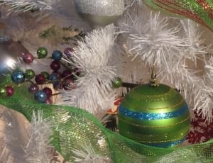 green and blue bauble on white garland thumbnail