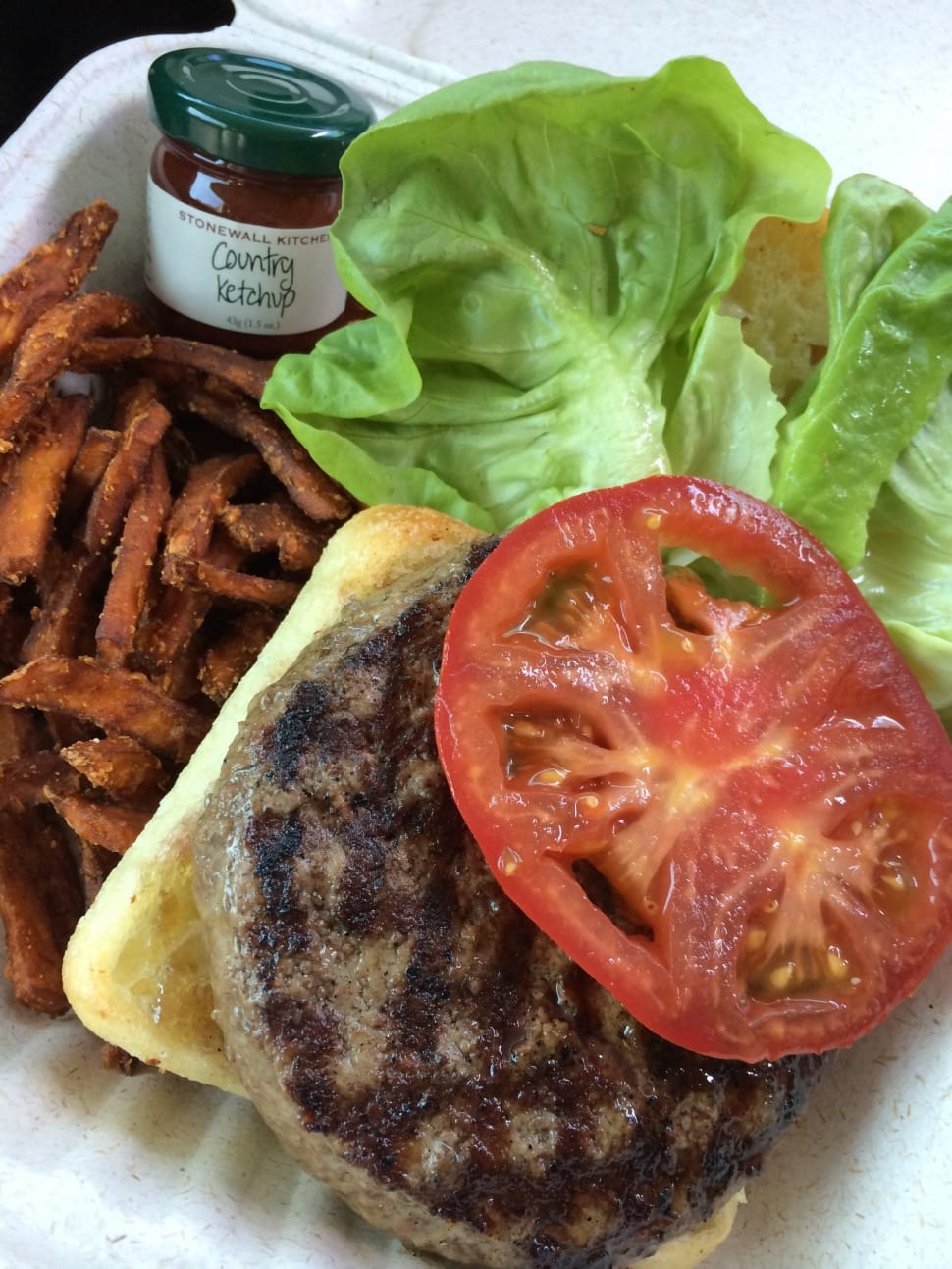 grilled burger steak with tomato and french fries preview