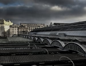 gray building roof under cloudy sky at daytime thumbnail